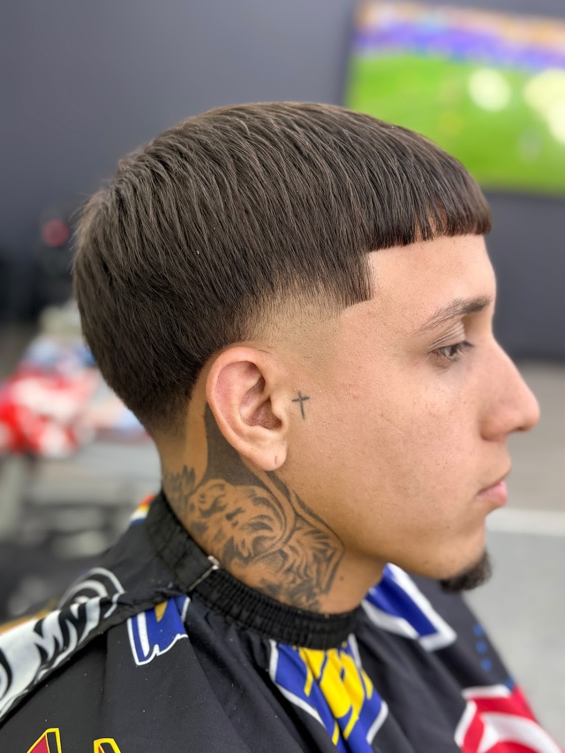 A completed low taper fade with a sharp lined finish